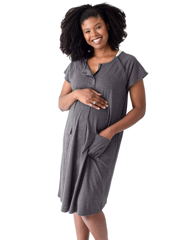 Model wearing the grey Kindred Bravely Universal Labor & Delivery Gown with pockets.